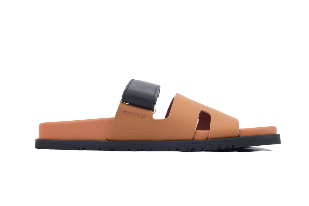 Hermès Chypre Slide Sandals in Tan and Black Leather