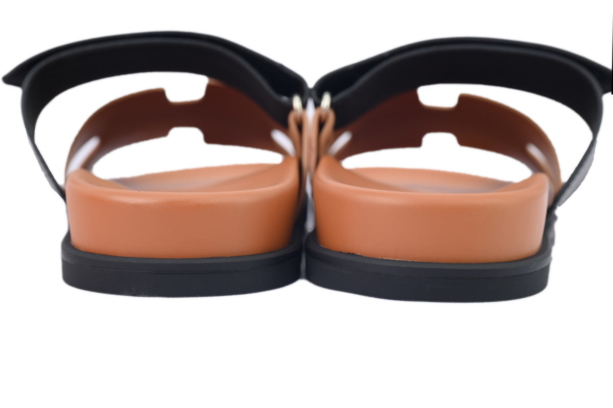 Hermès Chypre Slide Sandals in Tan and Black Leather