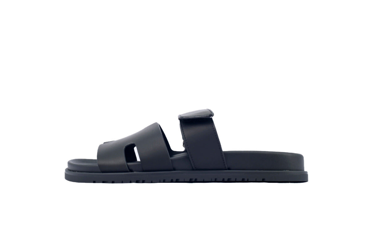 Hermès Chypre Slide Sandals in Black Leather