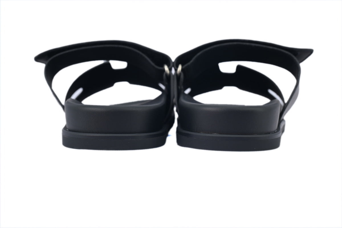 Hermès Chypre Slide Sandals in Black Leather