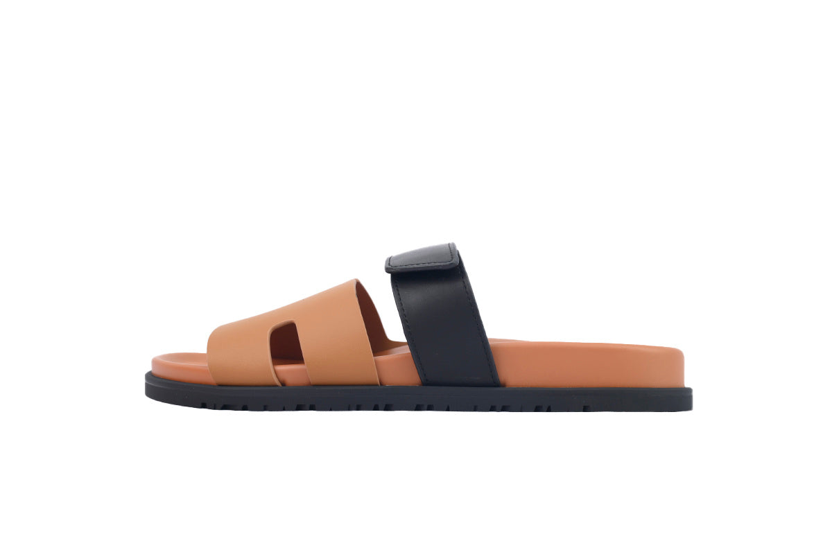 Hermès Chypre Slide Sandals in Tan and Black Leather