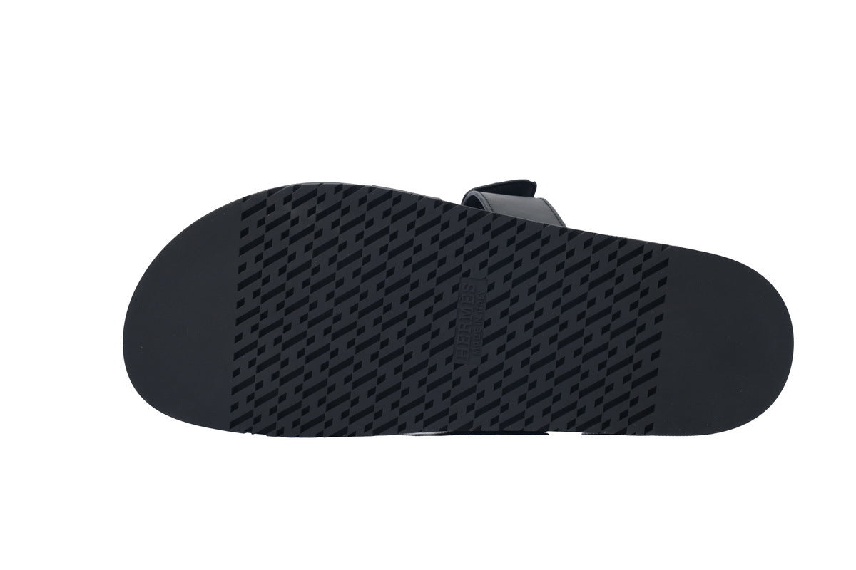 Hermès Chypre Slide Sandals in Black Leather