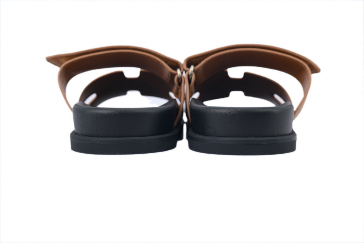 Hermès Chypre Slide Sandals in Tan Leather