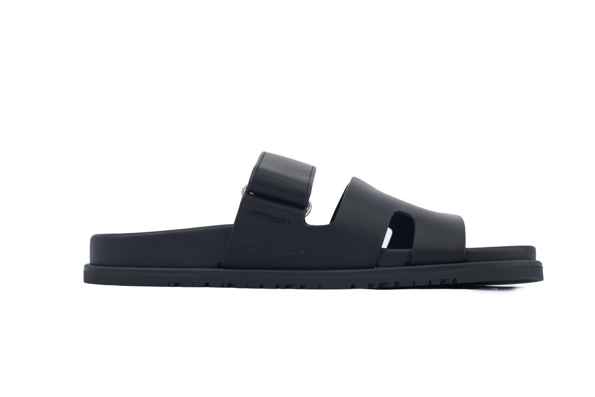Hermès Chypre Slide Sandals in Black Leather